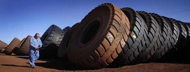 Tyres from heavy earth-moving trucks at the Tom Price iron ore mine in Pilbara, Western Australia. Credit: Jack Atley/Bloomberg via Getty Images.