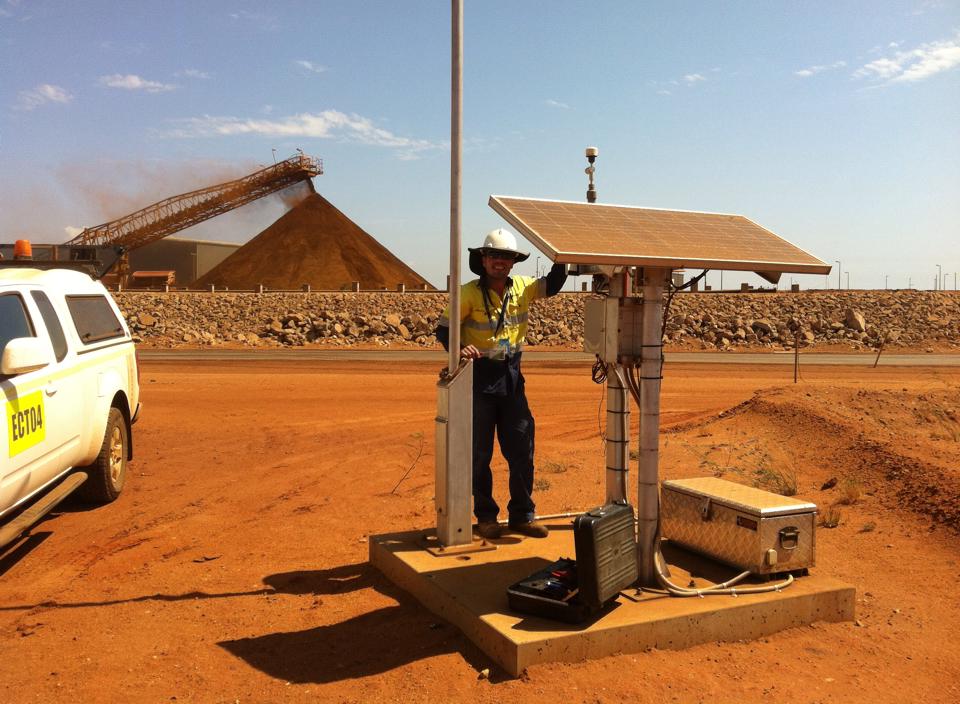 Solar-powered particulate monitor in Port Hedland, Western Australia. ECOTECH Technical Support Specialist, Nuno Rodrigues, performing site maintenance.